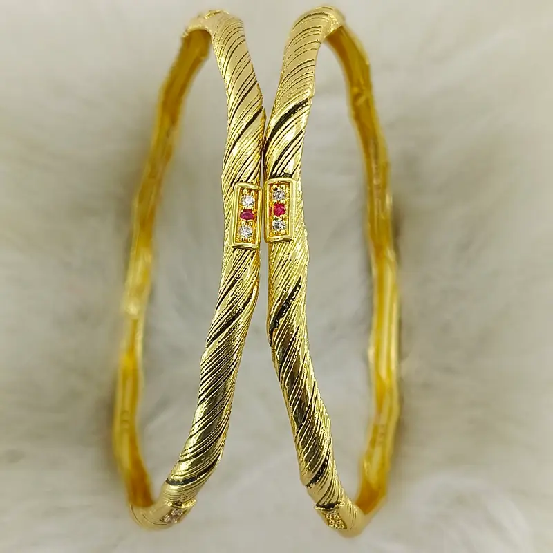 Fancy Twisted Gold Plated American Diamond Bangles Kadli Kada